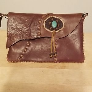 Leather clutch with turquoise stone. Hand stiched.